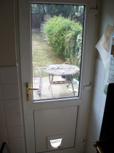 Fitting cat flap in double best sale glazed door